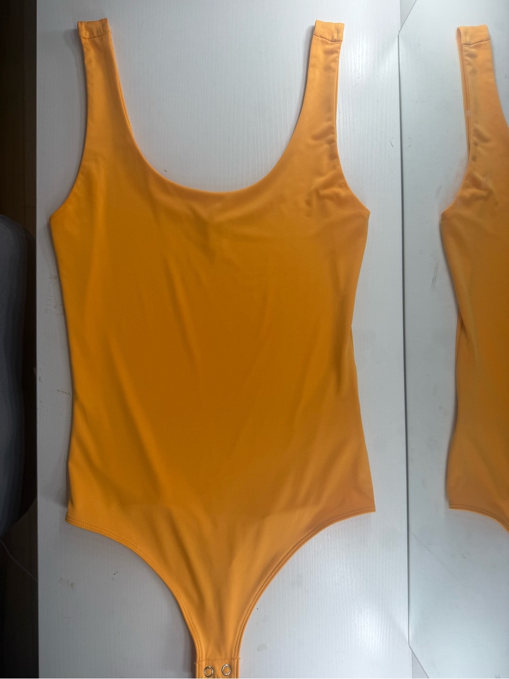Woman’s Solid Orange One-Piece Bodysuit